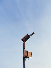 Low angle view of street light against sky