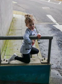 High angle view of cute girl looking at camera