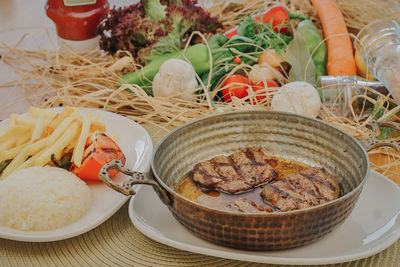 High angle view of vegetables in basket on table