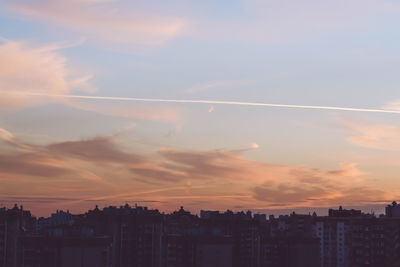 Buildings against sky during sunset