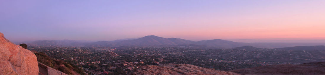 Aerial view of town against sky during sunset