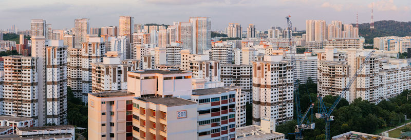 High angle view of buildings in city against sky