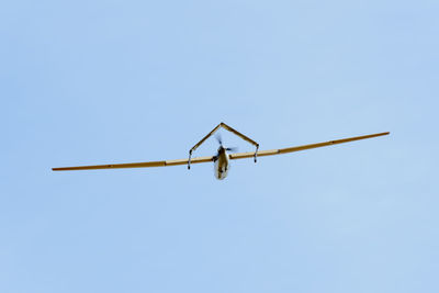 Low angle view of airplane flying in sky