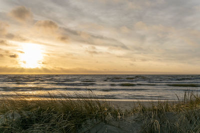 Scenic view of sea against sky during sunset