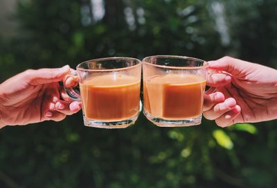 Close-up of hand holding drink