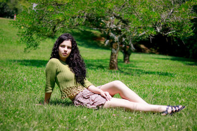 Teenage girl sitting at park