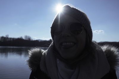 Portrait of smiling man against sky during winter