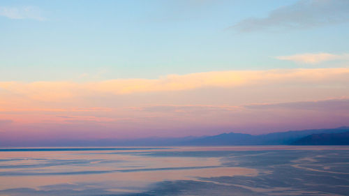 Scenic view of beach at sunset