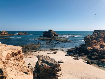 Scenic view of sea against clear blue sky