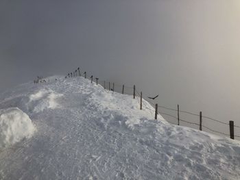 Scenic view of snow covered mountain against sky