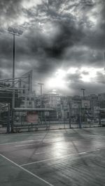 View of cityscape against cloudy sky
