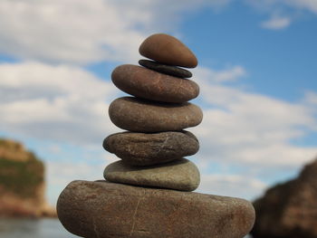 Close-up of stack of stones by the beach