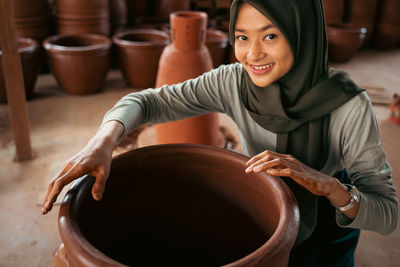 Cropped hand of woman preparing food