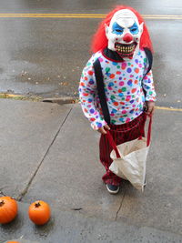 Full frame shot of boy with pumpkins