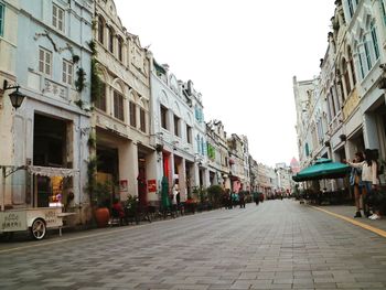 Street in city against clear sky