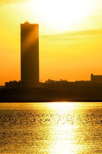 Silhouette of building at sunset