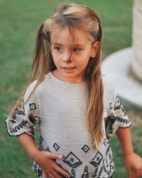 Portrait of a girl standing outdoors