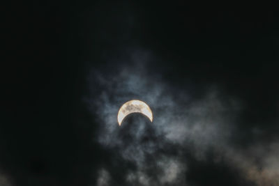 Low angle view of moon against sky at night