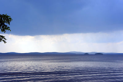 Scenic view of sea against blue sky