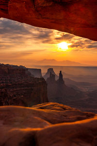 Scenic view of rock formations against sky during sunset