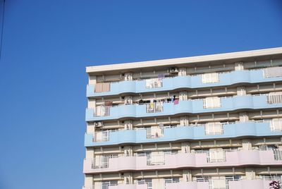 Low angle view of building against clear blue sky