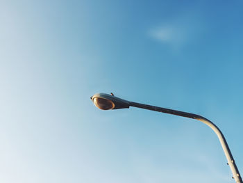 Low angle view of street light against sky