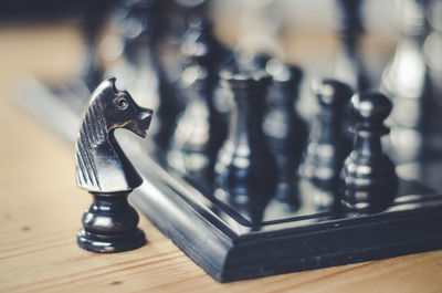 Close-up of chess pieces on table