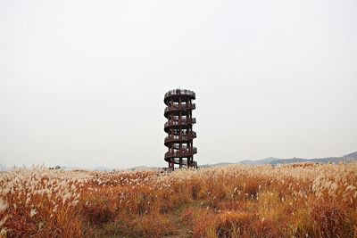 Built structure on field against clear sky