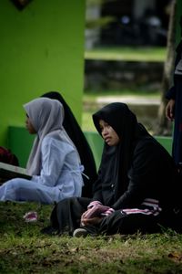 Group of people relaxing in temple