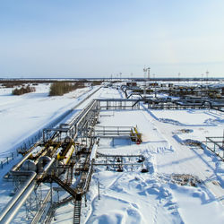 High angle view of snow covered landscape against clear sky