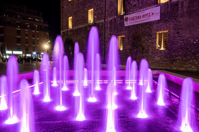 Panoramic view of illuminated building in city at night