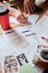 Midsection of man working on table