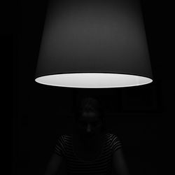 Illuminated electric lamp in dark room