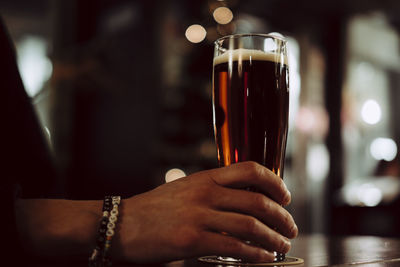 Close-up of hand holding drink