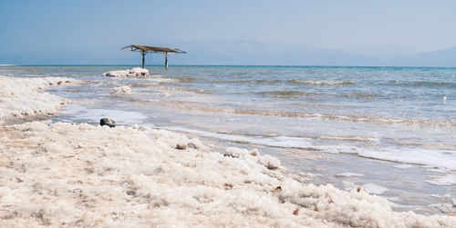 View of calm beach against the sky