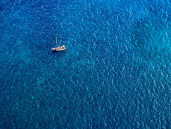 High angle view of boat sailing in sea