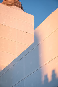 Low angle view of building against clear blue sky