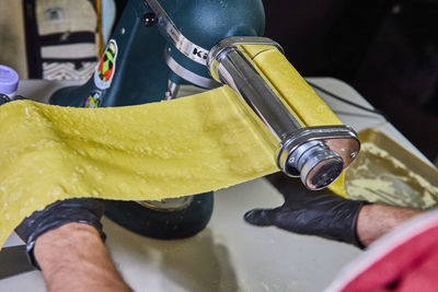 Cropped image of man holding bottle