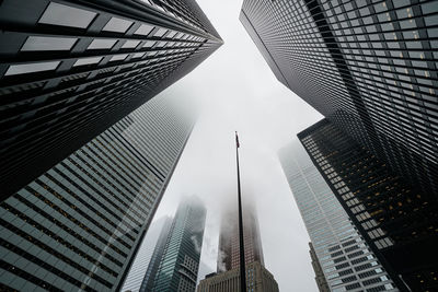 Low angle view of modern buildings against sky