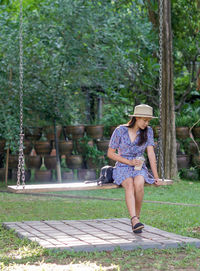 Full length of woman wearing hat