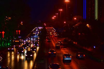 High angle view of traffic on city street at night