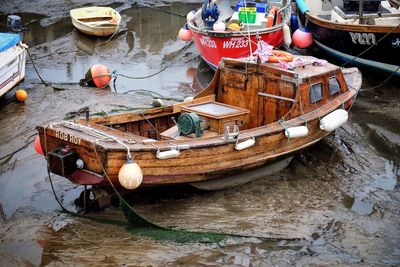 High angle view of boats moored at harbor