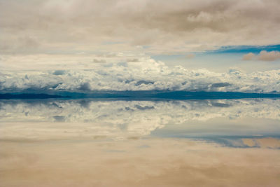 Idyllic shot of clouds reflection in water at salar de uyuni
