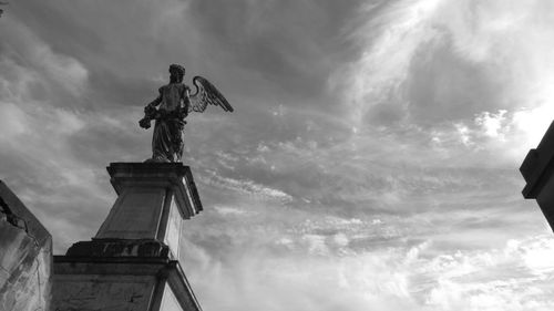 Low angle view of statue against sky