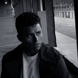 Portrait of young man standing outdoors