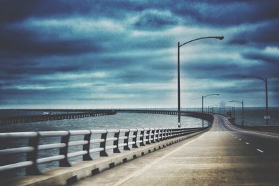 Road by sea against sky