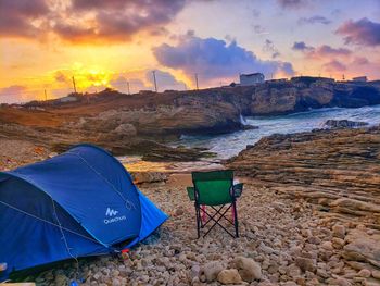 Scenic view of beach against sky during sunset