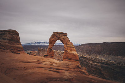 Rock formations on landscape against sky