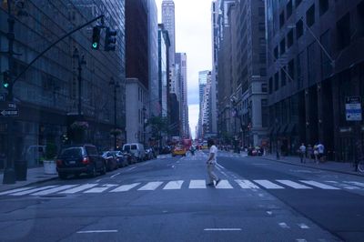 People walking on street in city