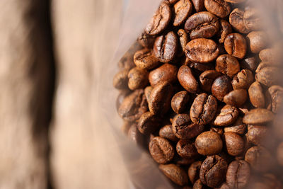 Close-up of coffee beans on table